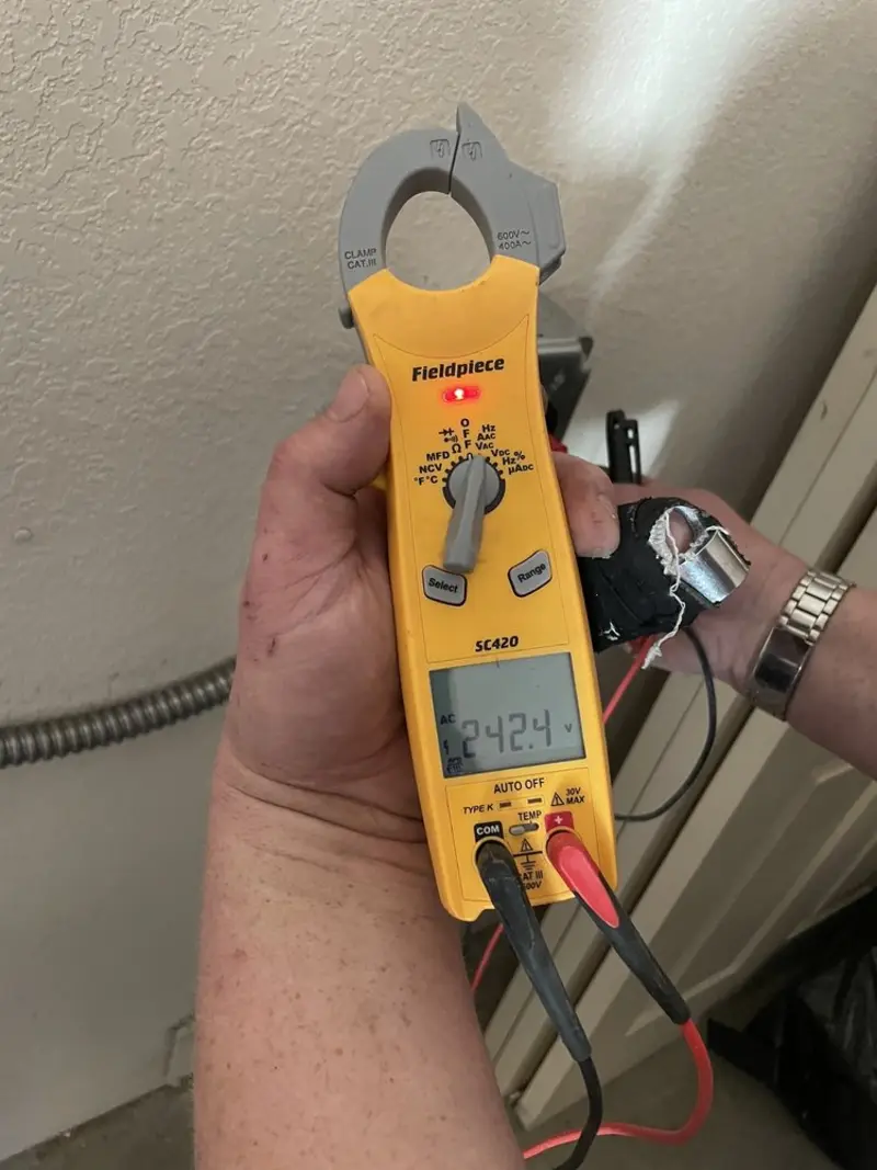 Voltage testing with clamp meter during Generator Installation in Solana Beach